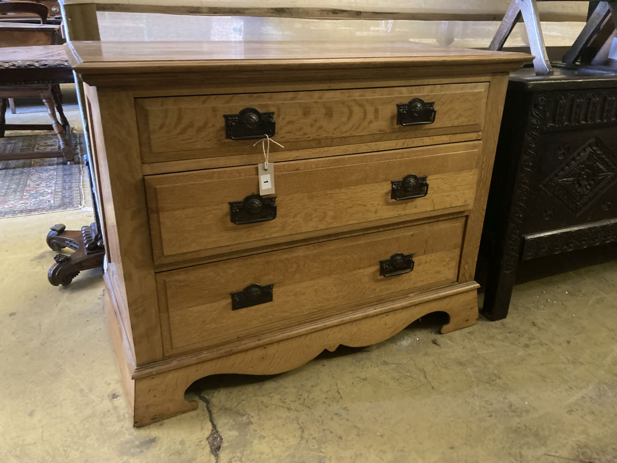 A late Victorian oak chest of three drawers, width 106cm, depth 55cm, height 81cm